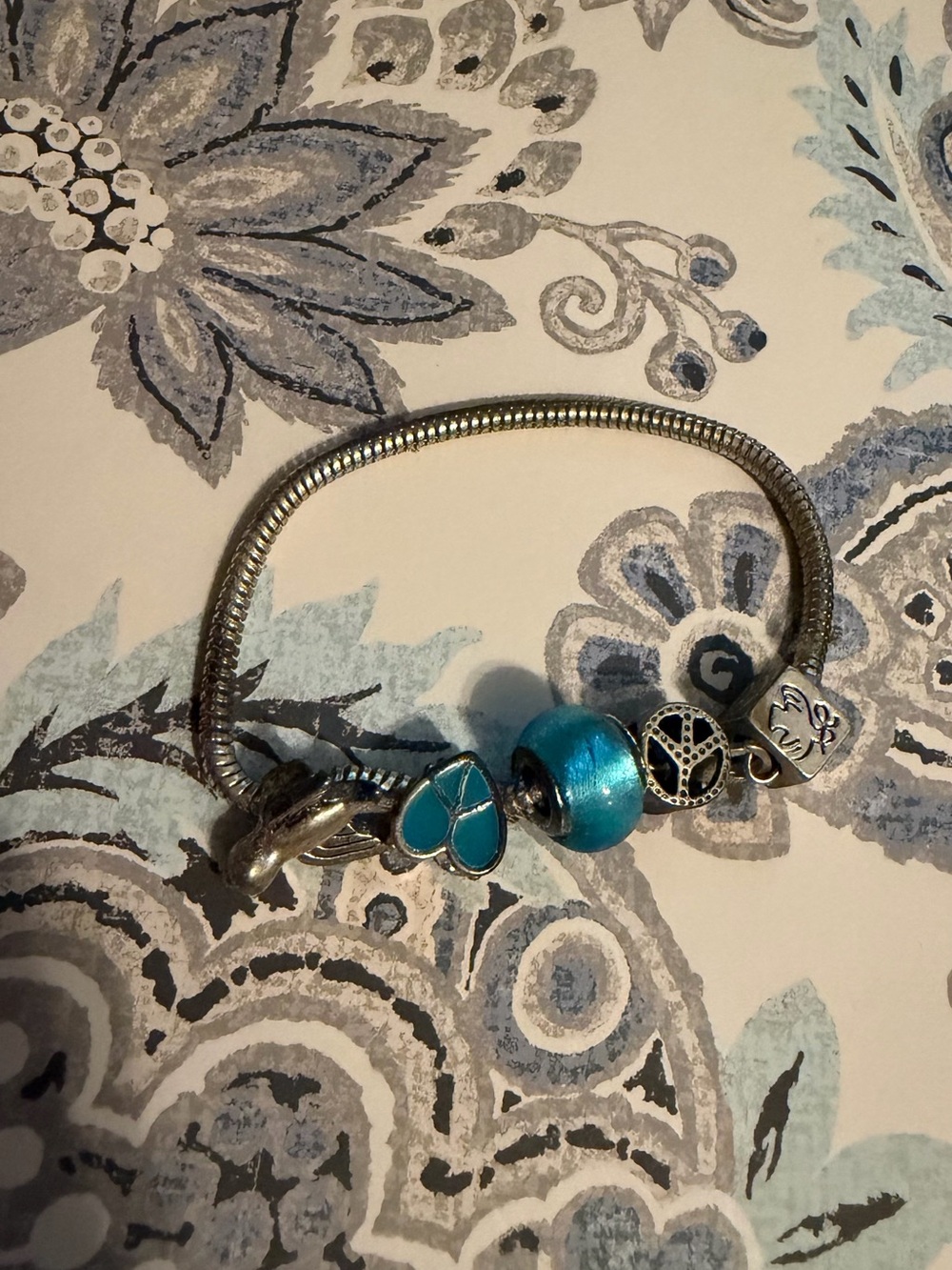 Turquoise Silver Charm Bracelet with Blue Beads birds and peace theme